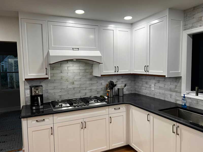 New white kitchen cabinets that were built by Stimis Enterprises LLC