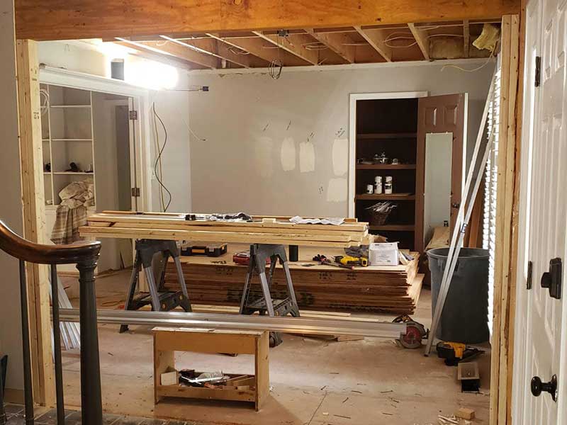 Wood and tools in a home interior for a pocket door remodeling job by Stimis Enterprises LLC